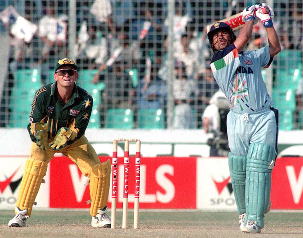 Sachin Tendulkar launches a big one down the ground, India v Australia, 3rd quarterfinal, Wills International Cup, Dhaka, October 28, 1998