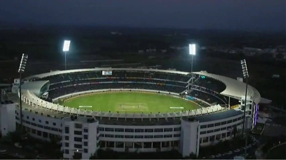 A current image of Gaddafi Stadium, highlighting its renovated seating and floodlights.