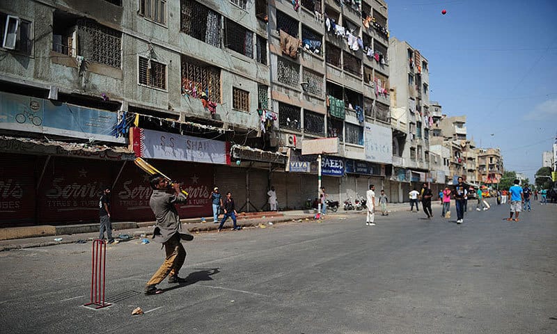 A photo of local kids or amateur players playing cricket on the streets or in a park, showing how ingrained cricket is in everyday life in Rawalpindi