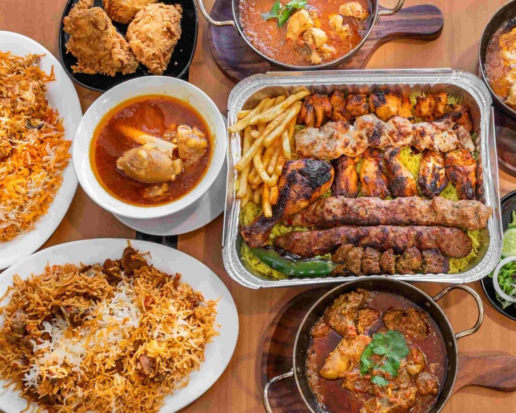 A platter of Karachi biryani, kebabs, and seafood.