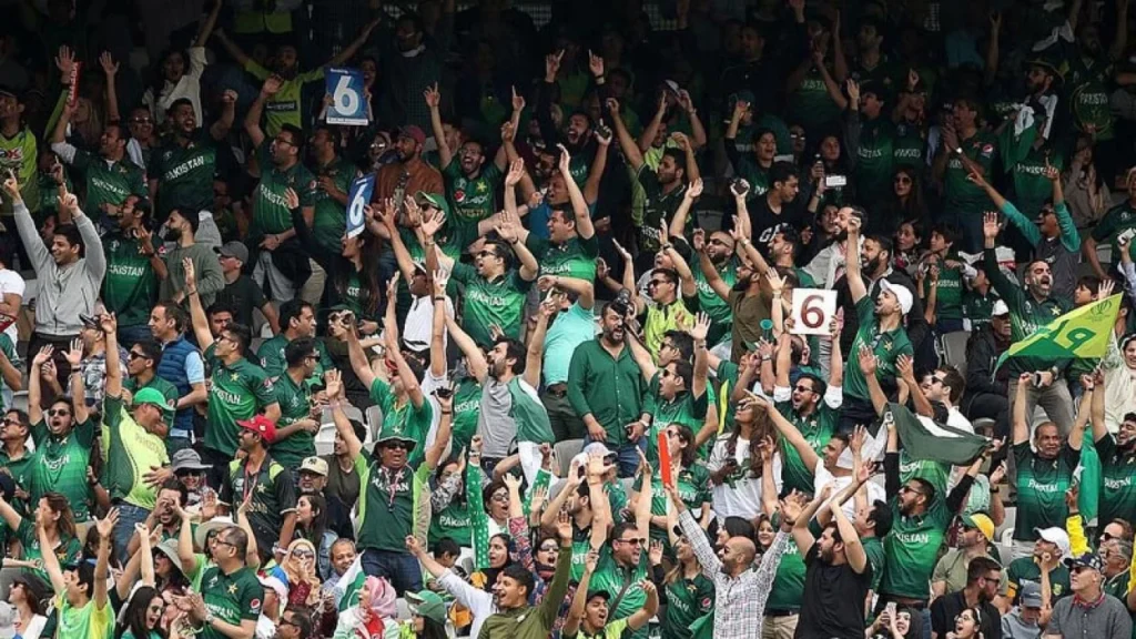 Fans cheering in the stands, showcasing Karachi’s passion for cricket.