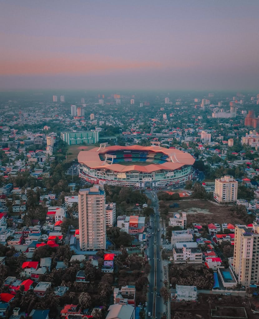 Captivating aerial view of Jawaharlal Nehru Stadium surrounded by cityscape in Ernakulam, Kerala.